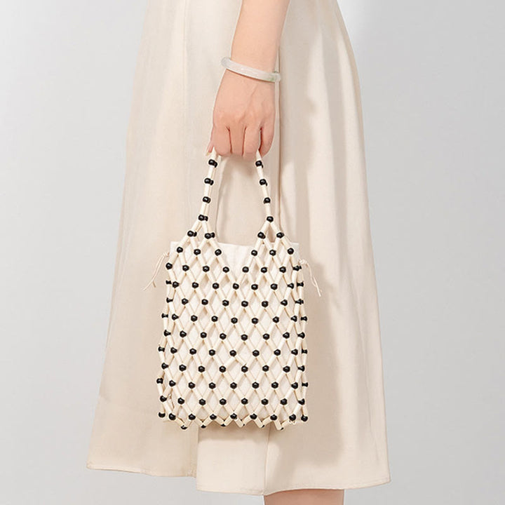 Buddha Stonesの手編みメッシュ中空木製ビーズハンドバッグ