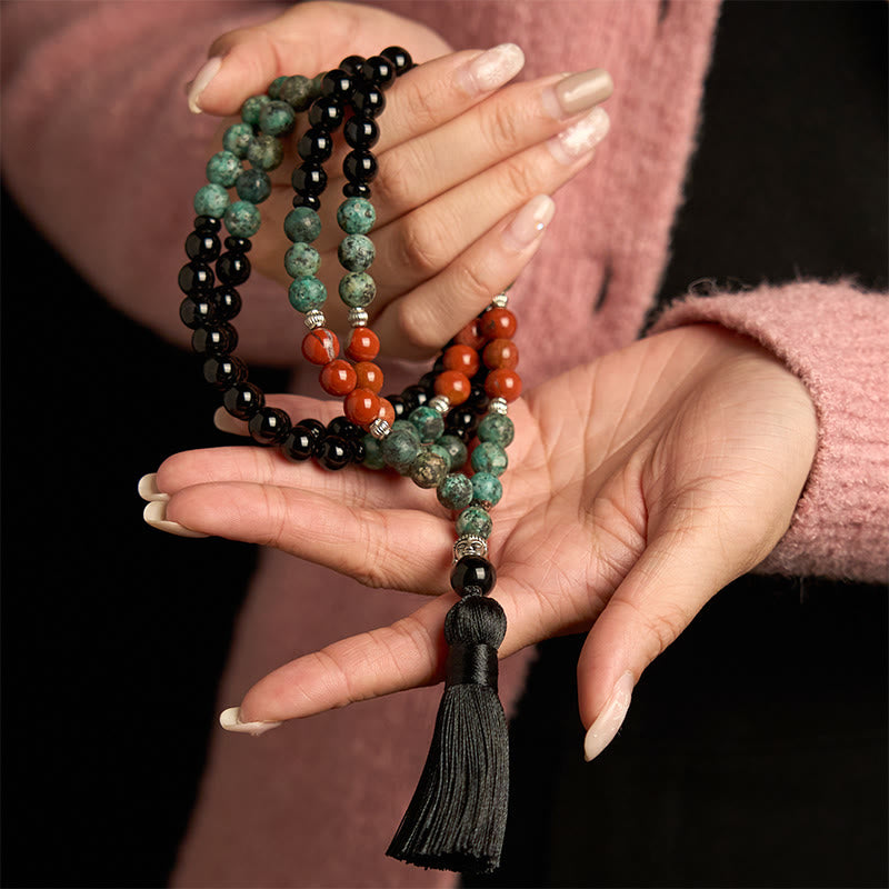 Buddha Stones 108Mala天然ブラックオニキス レッドジャスパー ターコイズビーズ 仏陀の頭 タッセル 保護ブレスレット