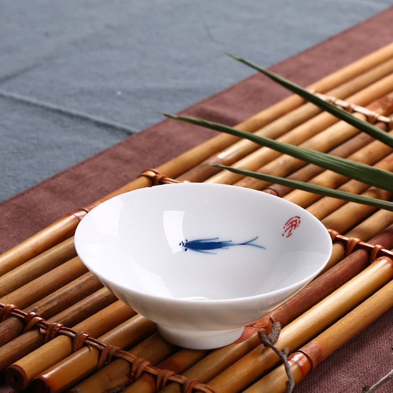 Buddha Stonesの青白磁の鯉の陶器ティーカップ、カンフーティーカップ