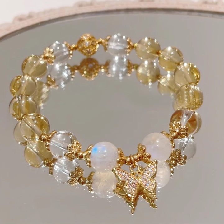 Buddha Stonesシトリン ムーンストーン バタフライチャーム 繁栄の守護ブレスレット