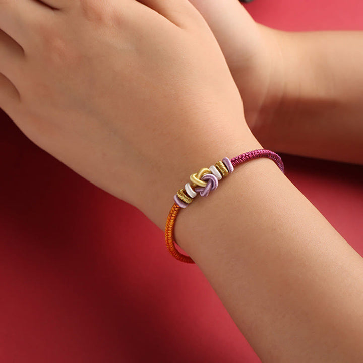Buddha Stonesのカラフルな紐ハートノット保護編みブレスレット