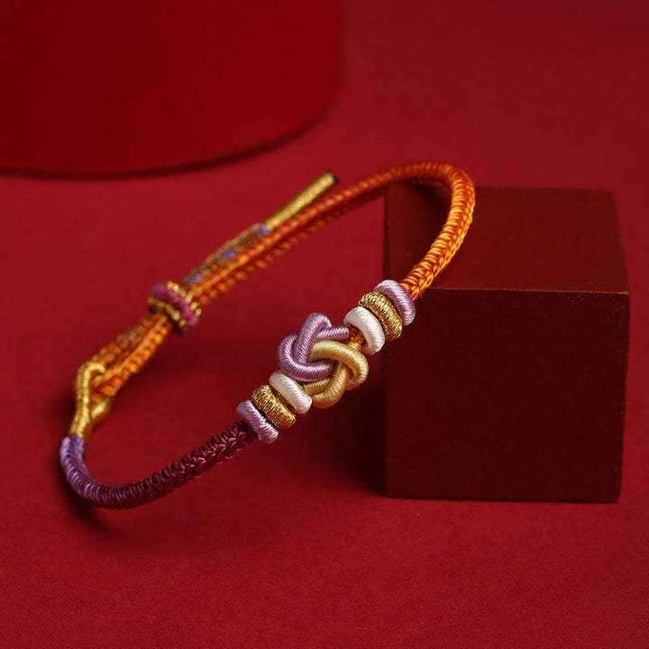 Buddha Stonesのカラフルな紐ハートノット保護編みブレスレット