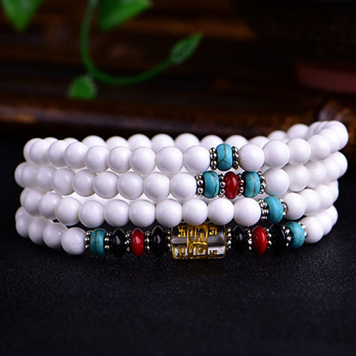 Buddha Stones 108 個のMalaビーズ 白磁 6 つの真実の言葉「Om Mani Padme Hum」忍耐ブレスレット