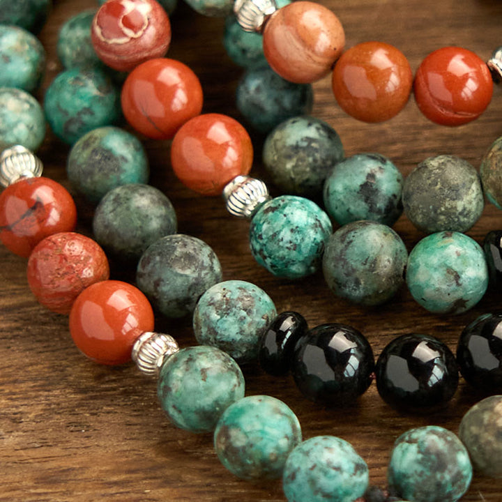Buddha Stones 108Mala天然ブラックオニキス レッドジャスパー ターコイズビーズ 仏陀の頭 タッセル 保護ブレスレット