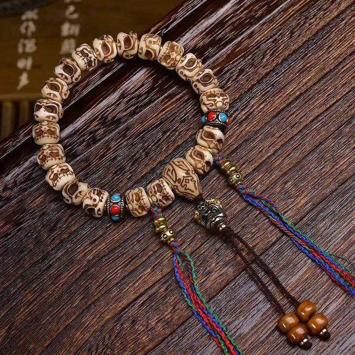 Buddha Stonesチベットラクダ骨ガルーダ彫刻保護タッセルブレスレット
