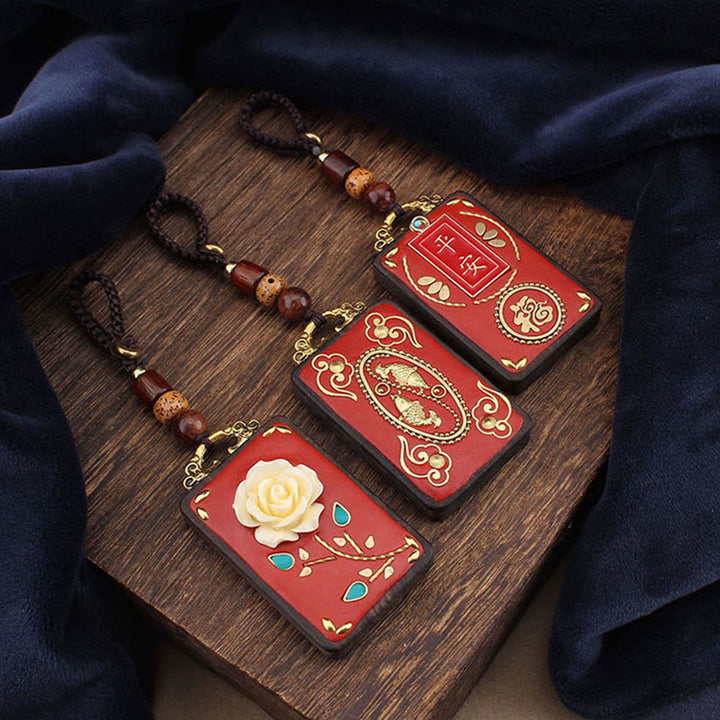 Buddha Stones、黒檀の花、鯉、風のキャラクターボタンロープキーホルダー - image 0