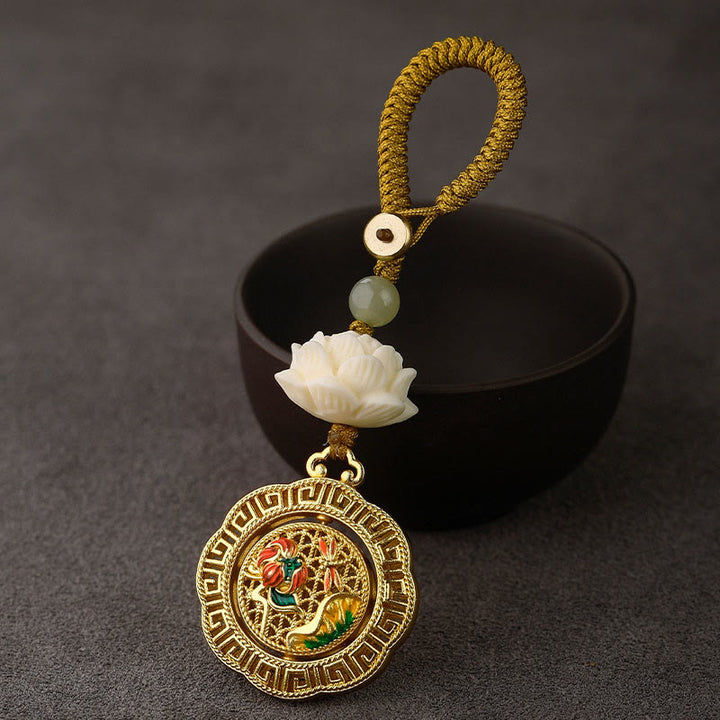 Buddha Stonesの実 蓮華 和田翡翠ビーズ 銅製 回転式 平和キーホルダー - トンボの蓮の葉 - 黄色いボタンロープ - image 0