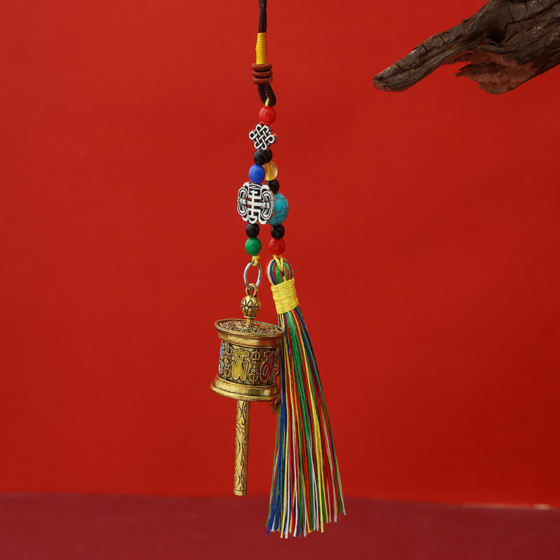 Buddha Stonesの祈祷ホイール、オーム・マニ・パドメ・フムのカラフルなタッセル、清浄のキーチェーン - アンティークゴールド - image 0