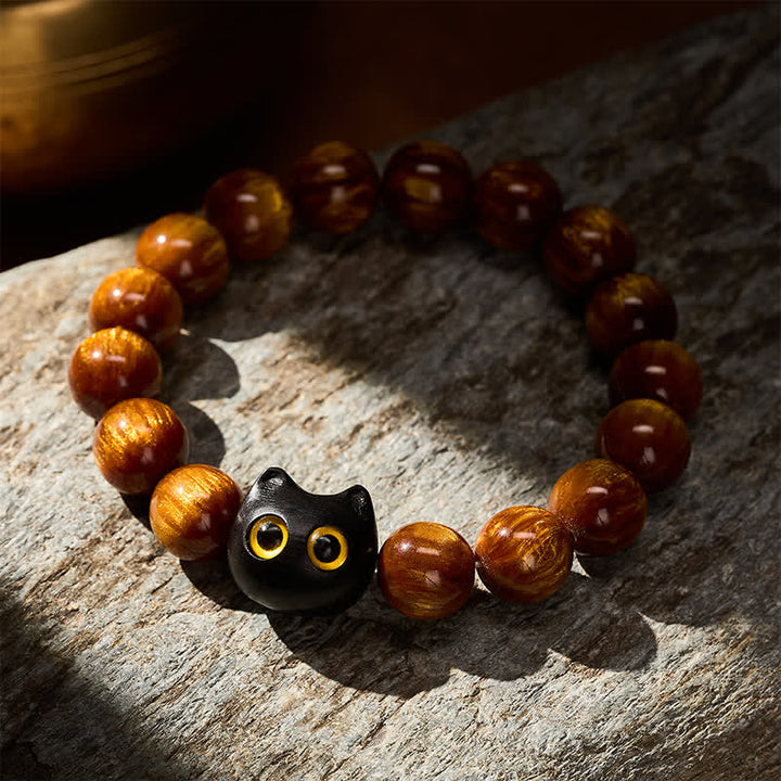 Buddha Stones 黄色の樹脂ビーズ、黄色の目、黒檀猫モチーフの落ち着いたブレスレット - image 3