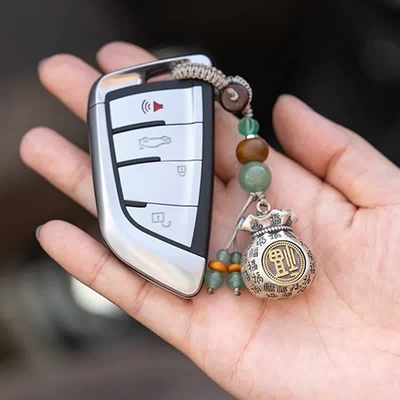 Buddha Stones 銅製の福の文字をモチーフにした手織りの良縁祈願バッグとビーズのキーホルダー - image 1