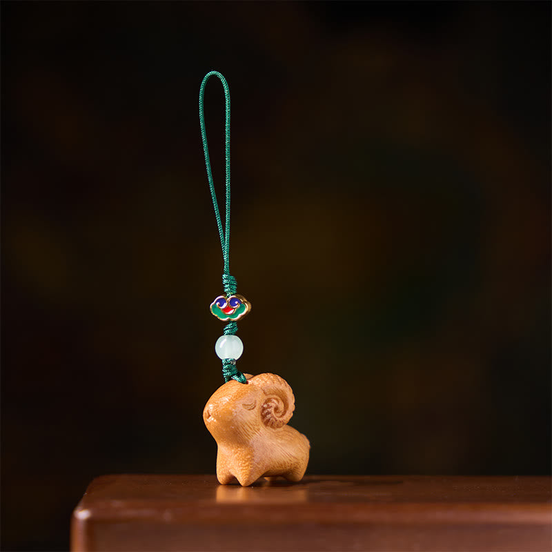 Buddha Stones 手彫りの白檀製ヤギのポジティブキーホルダー - image 8