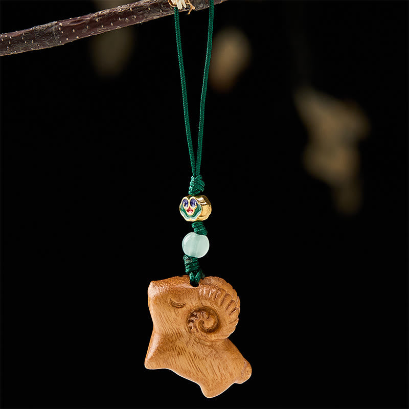 Buddha Stones 手彫りの白檀製ヤギのポジティブキーホルダー - image 9
