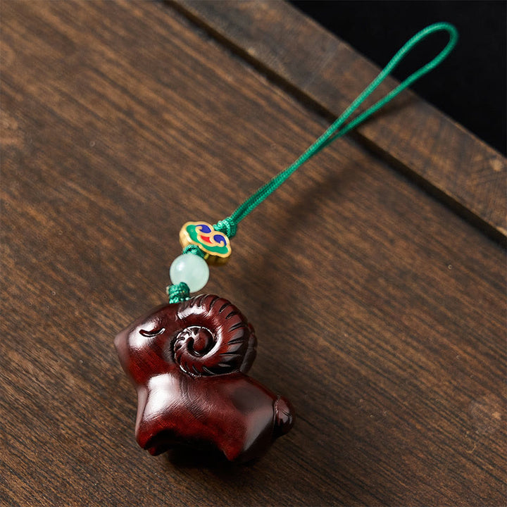 Buddha Stones 手彫りの白檀製ヤギのポジティブキーホルダー - image 17