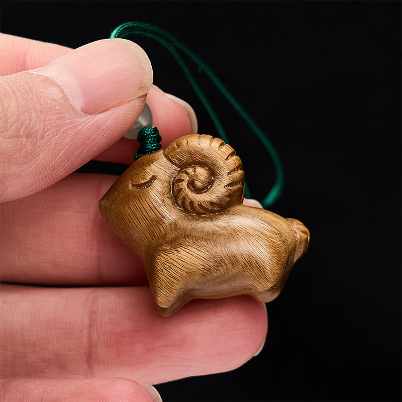 Buddha Stones 手彫りの白檀製ヤギのポジティブキーホルダー - image 4