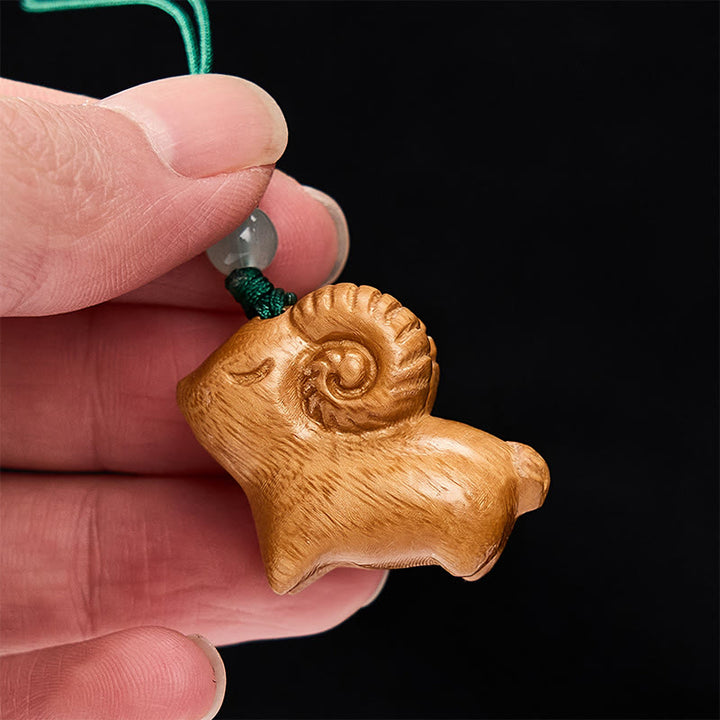 Buddha Stones 手彫りの白檀製ヤギのポジティブキーホルダー - image 12