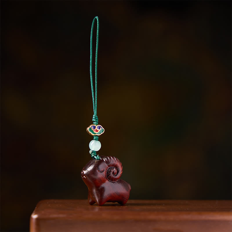 Buddha Stones 手彫りの白檀製ヤギのポジティブキーホルダー - image 15