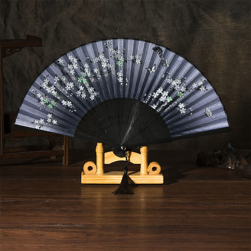 Buddha Stones 竹製蝶桜折りたたみ扇子 - 黒地表面　黒蝶（タッセル付き） - image 2