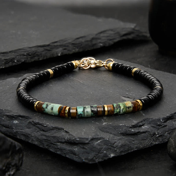 Buddha Stones ブラックオニキスとターコイズの保護ラウンドビーズブレスレット - image 1