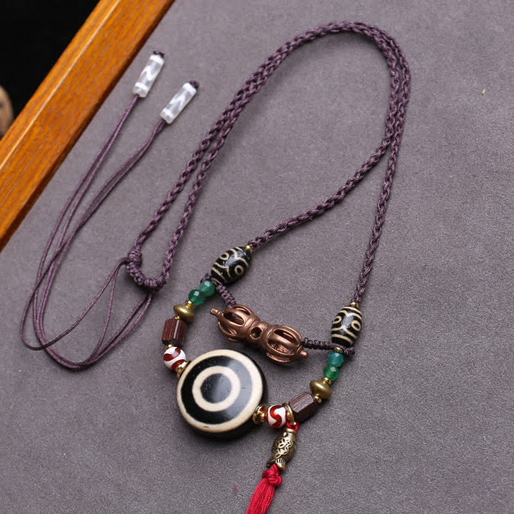 Buddha Stones チベットのジービーズ、ヴァジュラ、三つ目のジービーズ、編み込みロープの保護ネックレス - 約24×10mm - image 0