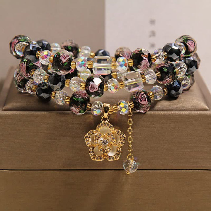 Buddha Stones ブラックリュウリガラスビーズフラワーカメリアチャームハーモニックコネクションブレスレット - ブラックカメリアチャーム - image 0