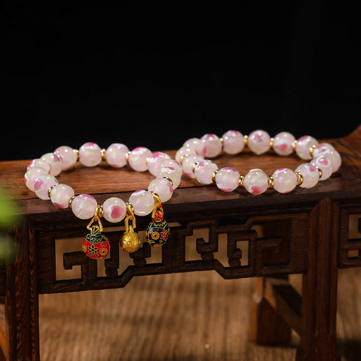 Buddha Stonesゴールド 呑み込み獣 ファミリーチャーム 光るピンク ラブハート 蛍光 Liuli ガラスビーズ 祝福ブレスレット