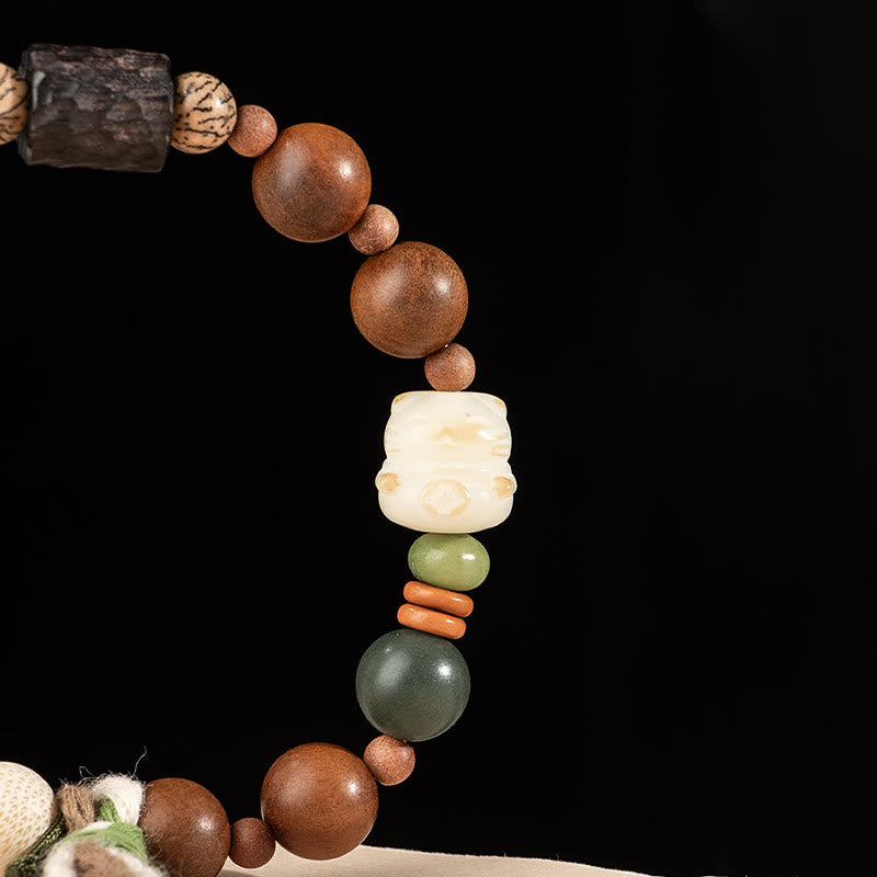 Buddha Stones雷撃 木製 菩提樹 猫の足爪 縁起物 守護 タッセルブレスレット - image 4