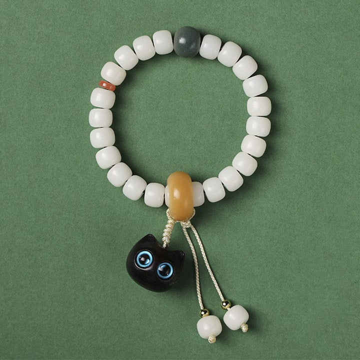 Buddha Stones天然菩提樹 アフリカンブラックウッド 愛らしい猫のチャーム 平和と調和のブレスレット - ブルーアイズキャット 菩提の種 - image 6