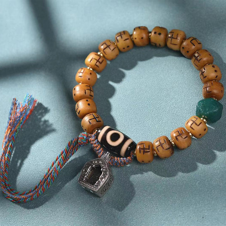 Buddha Stones天然チベットラクダ骨卍 Dzi ビーズ Shankha 仏陀チャーム Kirtimukha 幸運保護タッセルブレスレット