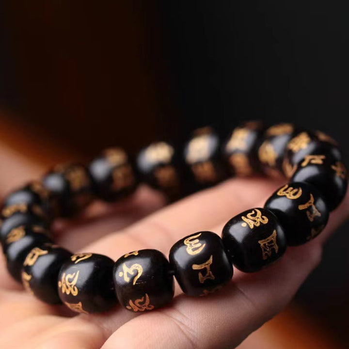 Buddha Stonesチベット黒檀オーム・マニ・パドメ・フム彫刻 平和ブレスレット