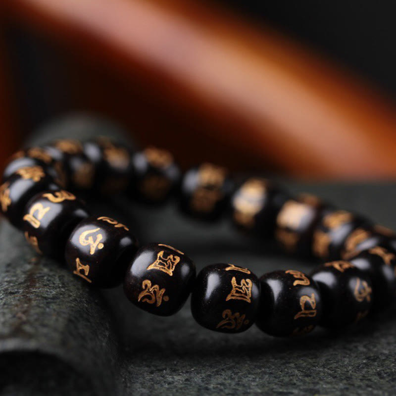 Buddha Stonesチベット黒檀オーム・マニ・パドメ・フム彫刻 平和ブレスレット
